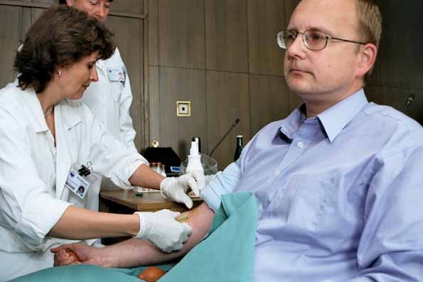 Taking a blood sample from Minister Ambrozek.jpg