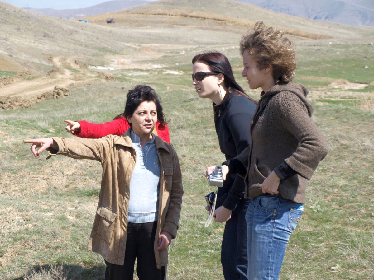 Laura Khachatryan points at the pesticide burial site.jpg