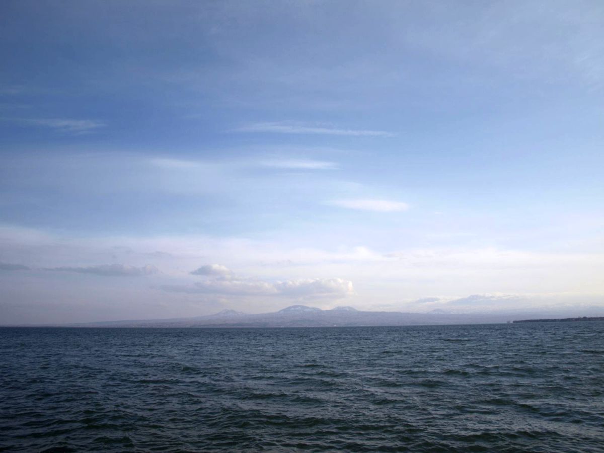Sevan and mountains rising above its water.jpg